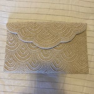 From St Xavier Ivory Chevy Beaded Clutch